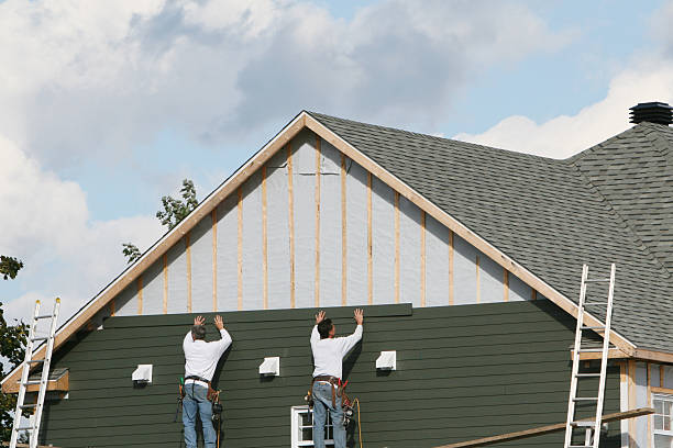 Professional Storm Damage Siding Repair technician working in Carversville, PA